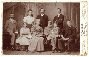 The Le Feuvre family in August 1895 (courtesy Simon Jenkins) Left to right: Charlie, Annie, Ithiel, Jane, Arthur, Samuel, Gertrude, Edmund, Vincent. Photographer: W.G. Lewis, 1 and 2, Seymour Street, Bath