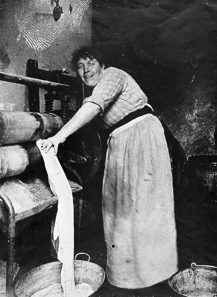 Victorian laundress at mangle