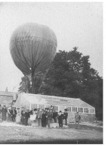 Group of local dignitaries assembled with Patrick Alexander and his gas balloon tethered and inflated  218x300
